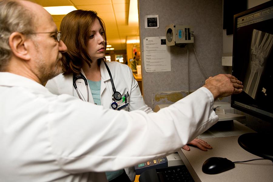 physicians reviewing patient data