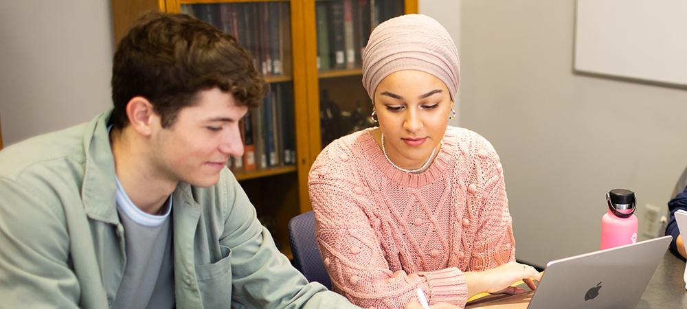 students discussing research