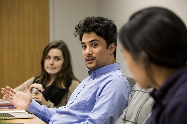 students discussing research