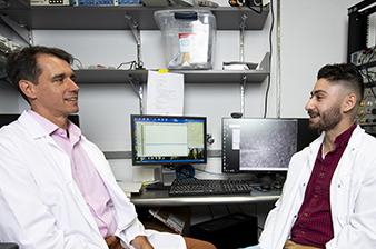 student and advisor discussing experiments