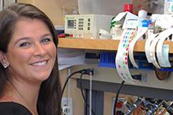 Student poses smiling