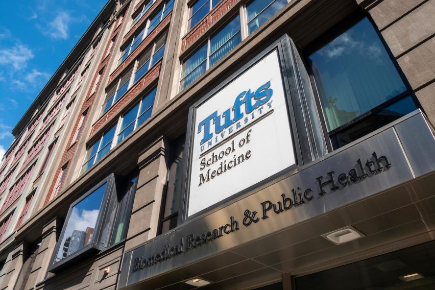 Image of the front of a Tufts building with GSBS on the sign