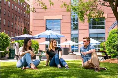 students relaxing outside